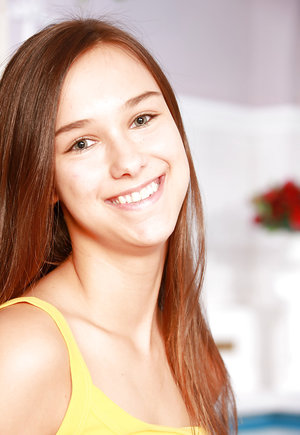 18 year old beauty Agnes takes great care in flaunting perky tits in the nude